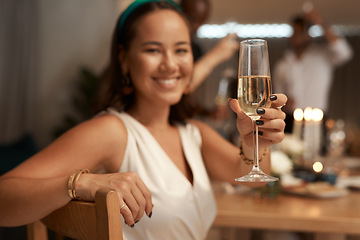 Image showing Woman, champagne and hand for toast in portrait, dinner or party for new year with friends, family or team. Happy celebration, sparkling wine or smile at supper for food, drinks or blurred background