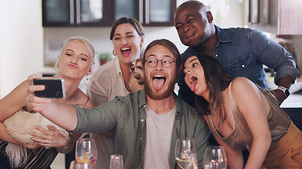 Image showing Friends, selfie and silly pose during dinner party at home to celebrate new years eve together. Phone, photo and funny face diverse group of people posing for a mobile picture during lunch