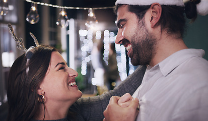 Image showing Couple, christmas and dancing with love, care and affection while at a christmas party to celebrate. Loving, caring boyfriend and girlfriend dance during a festive season or xmas celebration