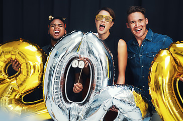 Image showing New year, happy and friends portrait with balloons at a social celebration in a event photobooth. Excited, smile and happiness party of people ready to celebrate a holiday with cheering at night