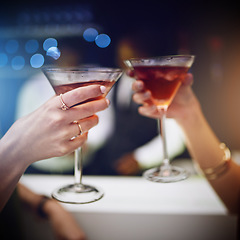 Image showing Hands, cocktail and party with friends drinking together in a nightclub for a new year celebration. Glass, toast and event with a female and friend celebrating with a cheers in a music club or disco