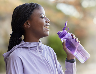 Image showing Black woman, water bottle and fitness run outdoor, relaxing and happy smile for healthy and wellness lifestyle in nature. Gen z female, hydrate and drink after exercise, cardio workout and happiness