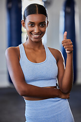 Image showing Thumbs up, Indian woman and fitness, wellness and exercise health model with positive energy in gym. Motivation, encouragement and support for happy training workout, sports athlete and healthy goal