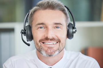 Image showing Call center, customer service and sales with a man consulting using a headset in his sales office. Crm, contact us and telemarketing with a male consultant working in retail support for communication