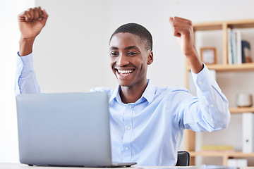 Image showing Black businessman, laptop and office with celebration, winning and success on stock market with smile. Happy black man, winner and celebrate for profit in crypto, stock investment or trading online