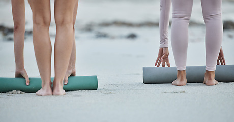 Image showing Yoga mat, women legs and beach sand after fitness exercise, workout and balance training for peace, zen and calm mindfulness. People together outdoor in nature for morning pilates wellness routine