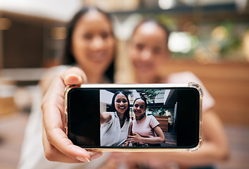 Image showing Phone, friends and woman with selfie on screen enjoying shopping, quality time and weekend at the mall. Friendship, social media and happy girls taking picture for memories on holiday on smartphone