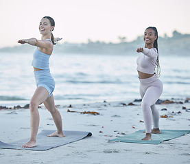 Image showing Friends, yoga and stretching on the beach for health, wellness and body fitness by the ocean. Seaside, sport and active women yogi with friendship for active, fit and peaceful workout or exercise