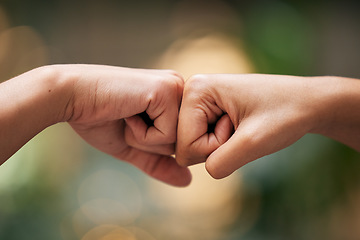 Image showing Closeup fist bump, hands and greeting for friends, team or support for power, solidarity or touch. Hand connection, teamwork and motivation with knuckle, friendship and together by blurred background