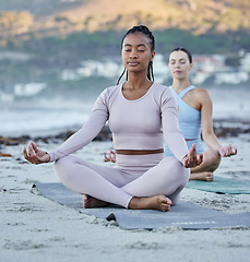 Image showing Beach meditation, diversity and yoga women meditate for chakra energy healing of soul, aura or spiritual balance. Freedom, lotus and zen people relax on sand for mindset peace, pilates or mindfulness