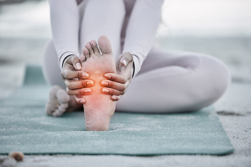 Image showing Woman, foot pain and injury at beach after yoga practice, stretching or workout for health and wellness. Sports, pilates or female massage feet, fibromyalgia or muscle tension after exercise outdoors