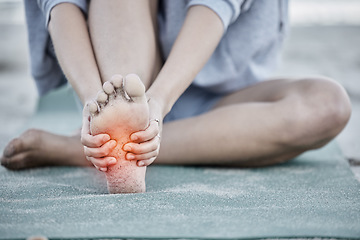 Image showing Foot, injury and pain with a woman holding her sole during fitness exercise with digital CGI or overlay. Workout, training and beach with a female athlete suffering from a sore joint or bone