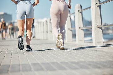 Image showing Beach, running and couple of friends legs for sports training, fitness and exercise together in summer wellness, support and accountability. Runner, athlete and marathon people feet in workout by sea