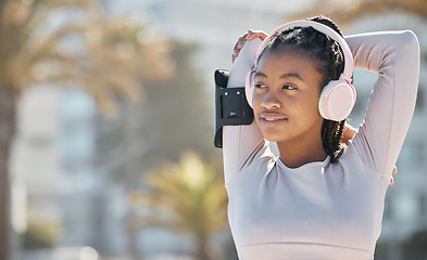 Image showing Black woman, exercise and fitness stretching outdoor and listening to music in nature for energy and cardio workout for health and wellness. Athlete runner with headphone for audio and streaming