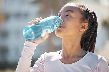 Image showing Drinking water, fitness and black woman in urban city with workout challenge for health, wellness and nutrition. Young sports, athlete or runner woman with water bottle for exercise, training outdoor