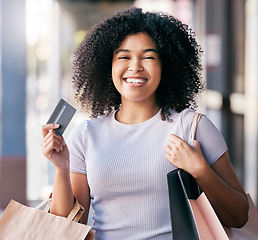 Image showing Black woman on street, credit card and shopping with bags, discount and retail therapy for clothes, buy and expensive. Jamaican female shopper, lady and customer with products, purchase and spending.