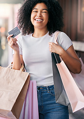 Image showing Credit card, shopping and black woman with financial payment, retail therapy and luxury at outdoor city for commerce, economy and budget. Finance, banking and excited or happy woman holiday shopping