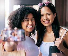 Image showing Friends, shopping and selfie with wealthy women happy about fashion, clothing and apparel purchase. Friendship, mobile photo for social media while in a shopping mall in the city for retail sales