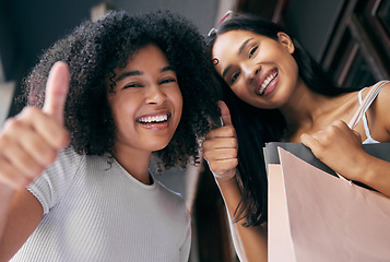 Image showing Shopping, friends and thumbs up with women excited about successful retail deal or black friday sale. Bags, buying and gesture with friendship portrait in a shopping mall, department store or store