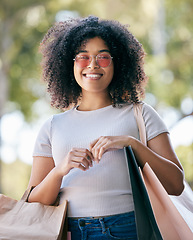 Image showing Woman, shopping and bags outdoor for expensive purchase and buying items. Young black woman, customer or female shopper with clothes, boutique products and spending for retail therapy, smile or relax