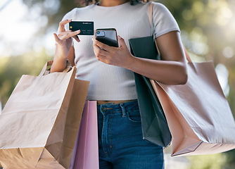 Image showing Credit card, sale and phone with black woman, luxury boutique for customer or online purchase in city. Female customer, online payment or clothes in bag from retail gifts in town market trip in paris