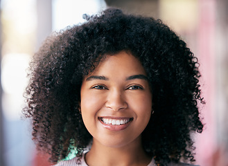 Image showing Face of happy black woman and relax on vacation in South Africa with an urban blurred background and afro. Portrait of professional girl, young African American with a smile and curly afro hair