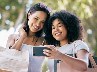 Image showing Selfie, phone and friends shopping in the city for luxury retail discounts, sales or promotions. Happy, smile and women taking a picture together with a cellphone while buying clothes in a urban town