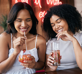 Image showing Cocktail, drink and happy hour with black woman friends drinking in a club or bar together for fun. Cafe, glass and cocktails with a young female and best friend enjoying a beverage while bonding