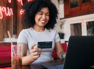 Image showing Woman, credit card and laptop in cafe, ecommerce and discount purchase. Young black woman, girl and female customer online shopping, expensive products and sale for consumer, buying and restaurant.