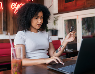 Image showing Woman, laptop and credit card for banking payment in a cafe or restaurant with fintech. Pc, coffee shop and female paying for ecommerce online shopping order while buying with a debit card