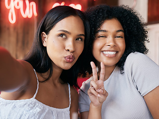 Image showing Black women, peace and sign with selfie in cafe, celebrate and party. Friends, girls and females with hand gesture, happy hour and restaurant to relax, happiness or bonding for weekend break or smile