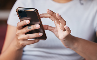 Image showing Hands, phone and woman on social media in home, texting or internet browsing. Zoom, cellphone and female with mobile smartphone for messaging, networking on app or web scrolling on social network.