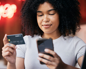 Image showing Phone, credit card and woman doing retail online shopping for a sale, discount or promotion. Bank card, cellphone and lady from Puerto Rico buying clothes on a internet store, shop or boutique.