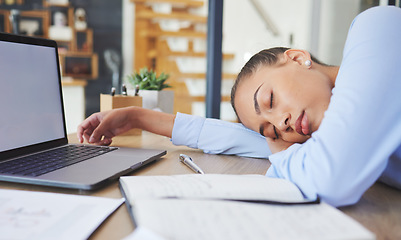 Image showing Tired, exhausted and business woman sleeping at her desk while working in a modern office. Burnout, sleepy and professional corporate employee taking a nap while planning a project at her workplace.