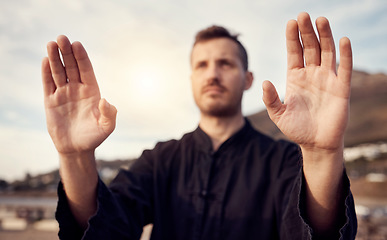 Image showing Karate, martial arts and hands of man doing tai chi workout, balance training and sports exercise. Motivation, fitness and male athlete with focus for mindfulness, wellness and zen energy by sea