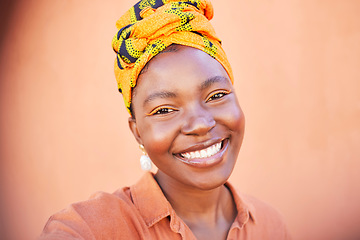 Image showing Face, portrait and selfie of black woman in turban in studio on an orange mockup background. Fashion, makeup and female from Nigeria taking pictures for happy memory, social media or profile picture.