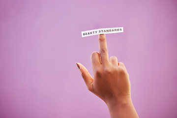 Image showing Woman, middle finger and beauty standards on studio background to protest opinion, society review and stereotype. Mockup, rude hand gesture and sign for anger, revolution and freedom of body ideals