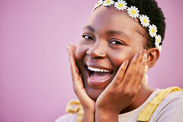 Image showing Happy, excited and portrait of a black woman with a flower crown in a studio with mockup space. Happiness, smile and face of African female model with floral band standing by pink background mock up.