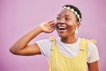 Image showing Happy, smile and black woman in a studio with a flower crown for a positive hipster aesthetic. Happiness, excited and young African female model with a floral headband isolated by a pink background.