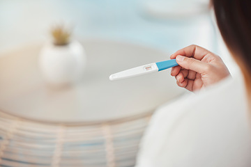 Image showing Hands, pregnant and home test of woman with positive result confirmation on maternity kit check. Prenatal, motherhood and fertility pregnancy test stripe information of girl expecting future baby.