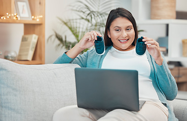 Image showing Pregnant, laptop and shoes for video call but happy mother making baby announcement online. Baby shoes, pc and video conference with a mom excited about her pregnancy, a newborn and motherhood