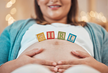 Image showing Pregnancy, mother pregnant and building blocks for child gender reveal of girl daughter. Future mom, healthy kid and prenatal woman with hands on stomach for baby love, bonding and pain relief care
