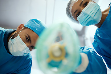 Image showing Health, surgeon and anesthesia, doctors and surgery with medical and cardiovascular healthcare, face mask and low angle view. Medicine, operation and health care team, cardiology and hospital.