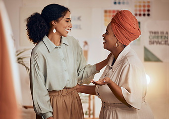 Image showing Designer women, planning conversation and fashion discussion with smile, happy and together in studio. Black woman, design partnership and teamwork talk in workshop for clothes, fabric and happiness