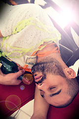 Image showing Party, drunk and alcohol with a man sleeping on the floor after a new year celebration or event closeup. Beer, social and tired with a male asleep in a house or home with a bottle after a birthday