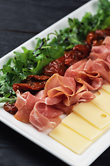 Image showing prosciutto cheese and sun-dried tomatoes