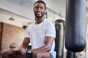 Image showing Black man, fitness and wellness training gym break of an athlete ready for sport exercise. Workout, sports and relax man after boxing and strong bodybuilder set with a smile in a health club