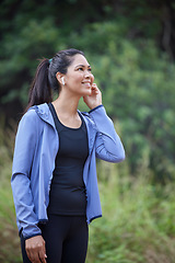 Image showing Fitness, wellness and woman in forest with earphones listening to music, audio and radio for workout. Sports, healthy lifestyle and girl in outdoor park for marathon training, running and exercise