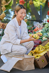 Image showing Bananas, shopping and Asian woman at outdoor market buying delicious and healthy fruits. Plantains, products and female from Japan purchasing fruit at street stall for vitamin c, health and wellness.
