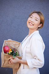 Image showing Woman, face or grocery basket with organic fruit, healthy food or Japanese diet produce on blue background with mockup advertising space. Portrait, smile or happy customer with supermarket vegetables